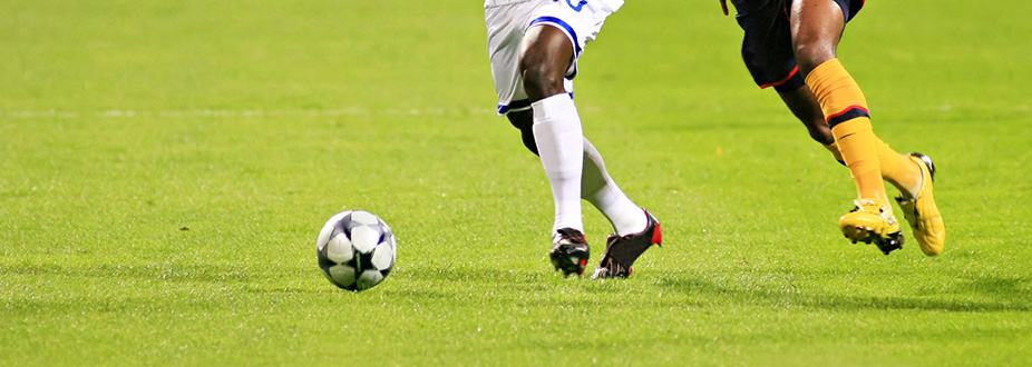 two soccer players playing soccer