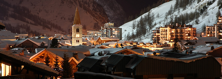 Val-Isere village at night with snow